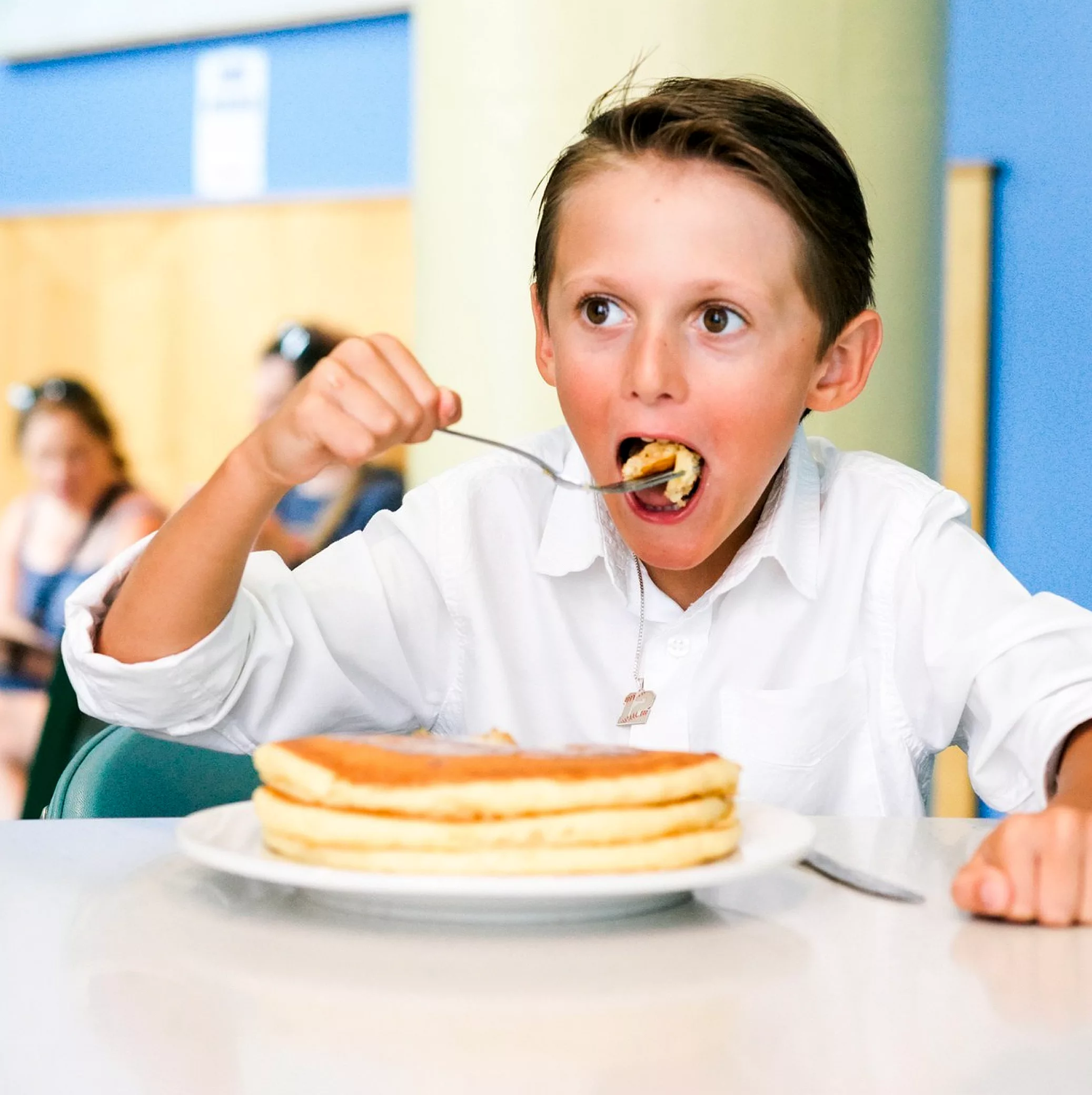 Boy with pancakes.